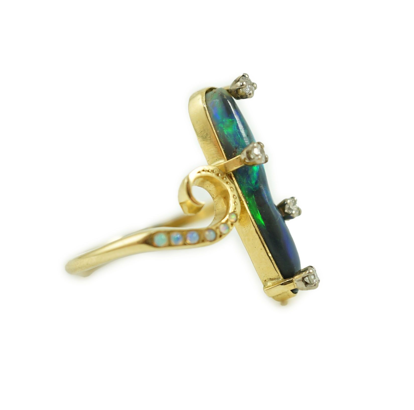 A stylish early to mid 20th century 18ct gold, black opal and diamond chip set dress ring